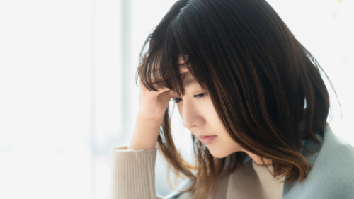 体調不良の若い女性