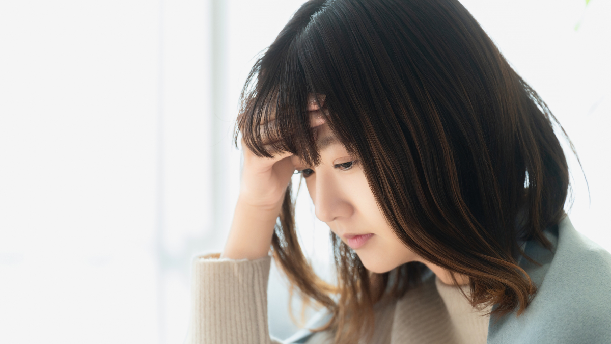 体調不良の若い女性